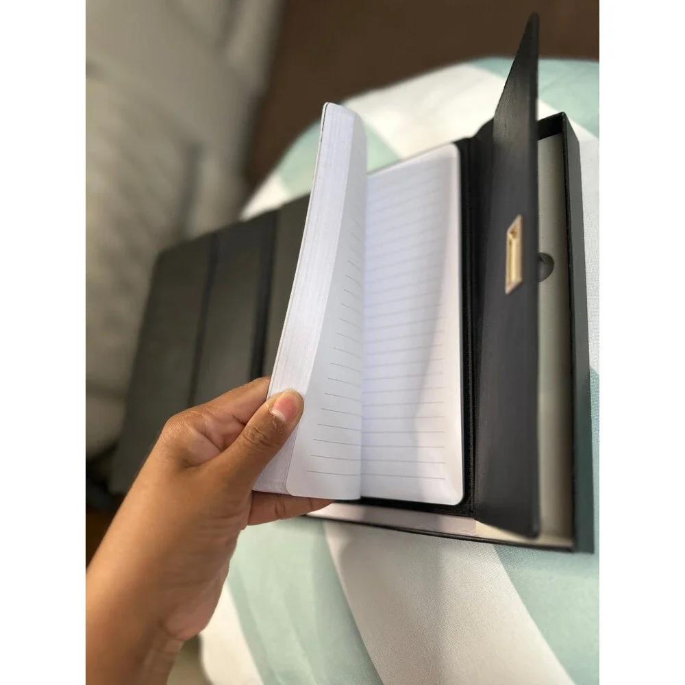 Black leather journal with pen